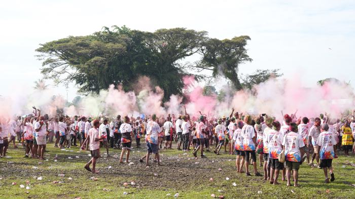Colour run crowd in clouds of coloured powder