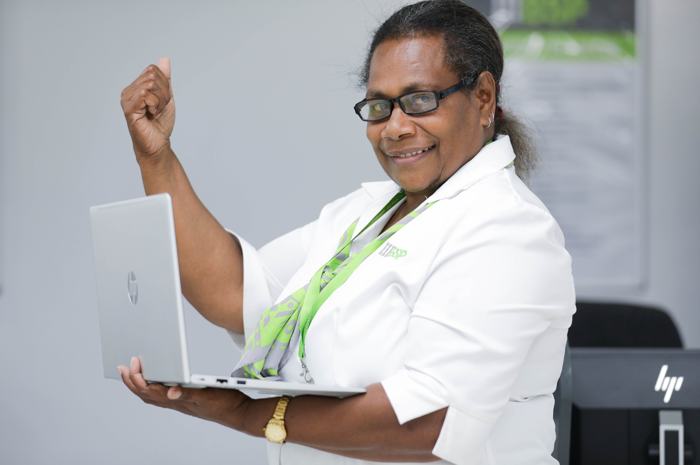 Participant celebrating with a new laptop