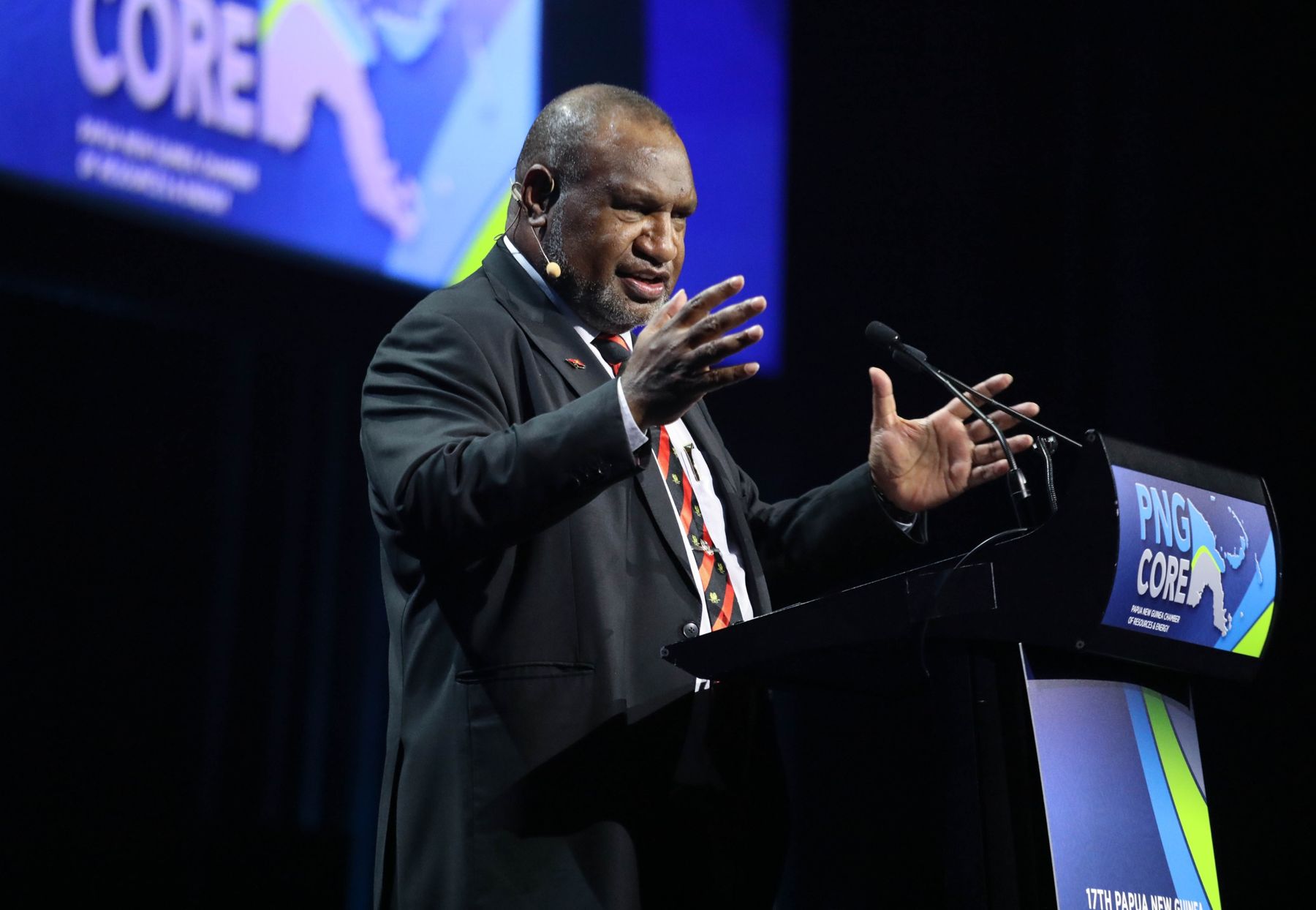 Keynote speaker at a resources conference podium