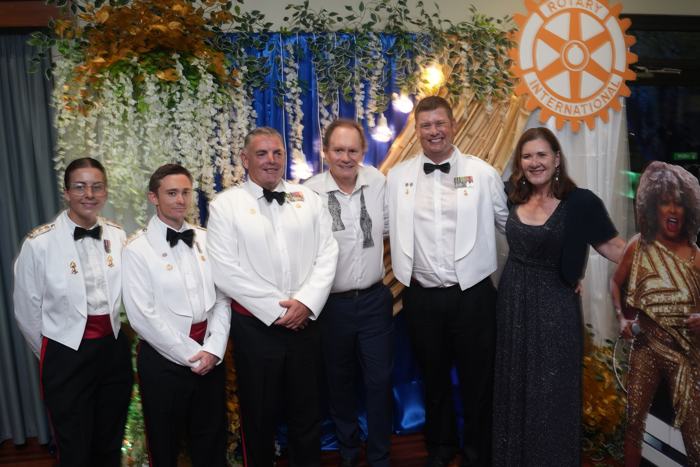 Rotary members in formal wear at a gala