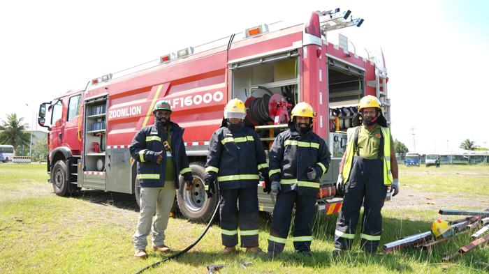 Fire crew beside a fire engine