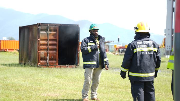 Fire officers at a training container