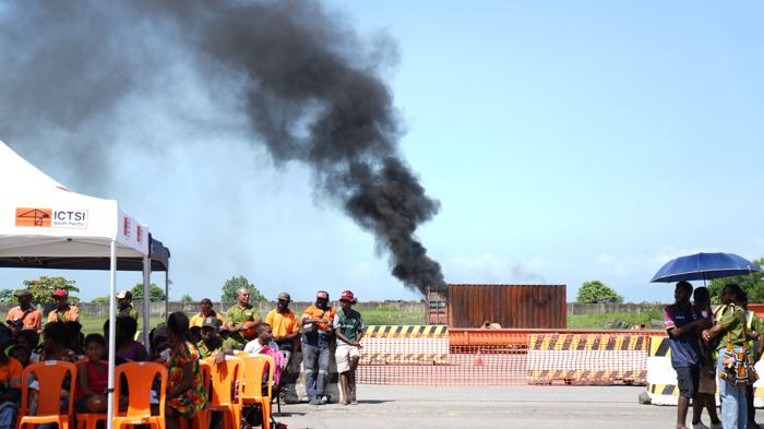 Workers watching a live fire demonstration