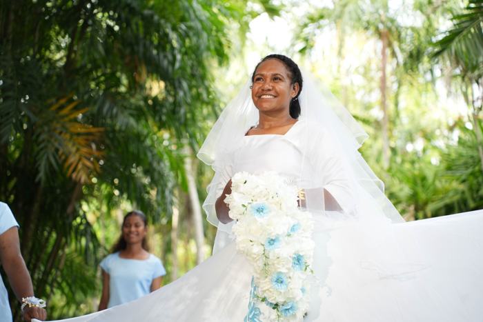 Bride with her bouquet in a garden