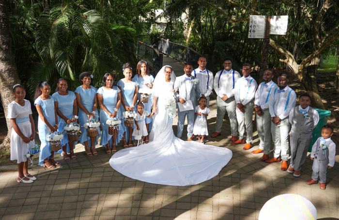 Bridal party gathered in a garden