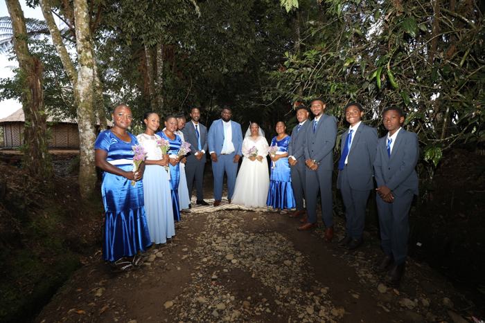 Bridal party in a forest clearing