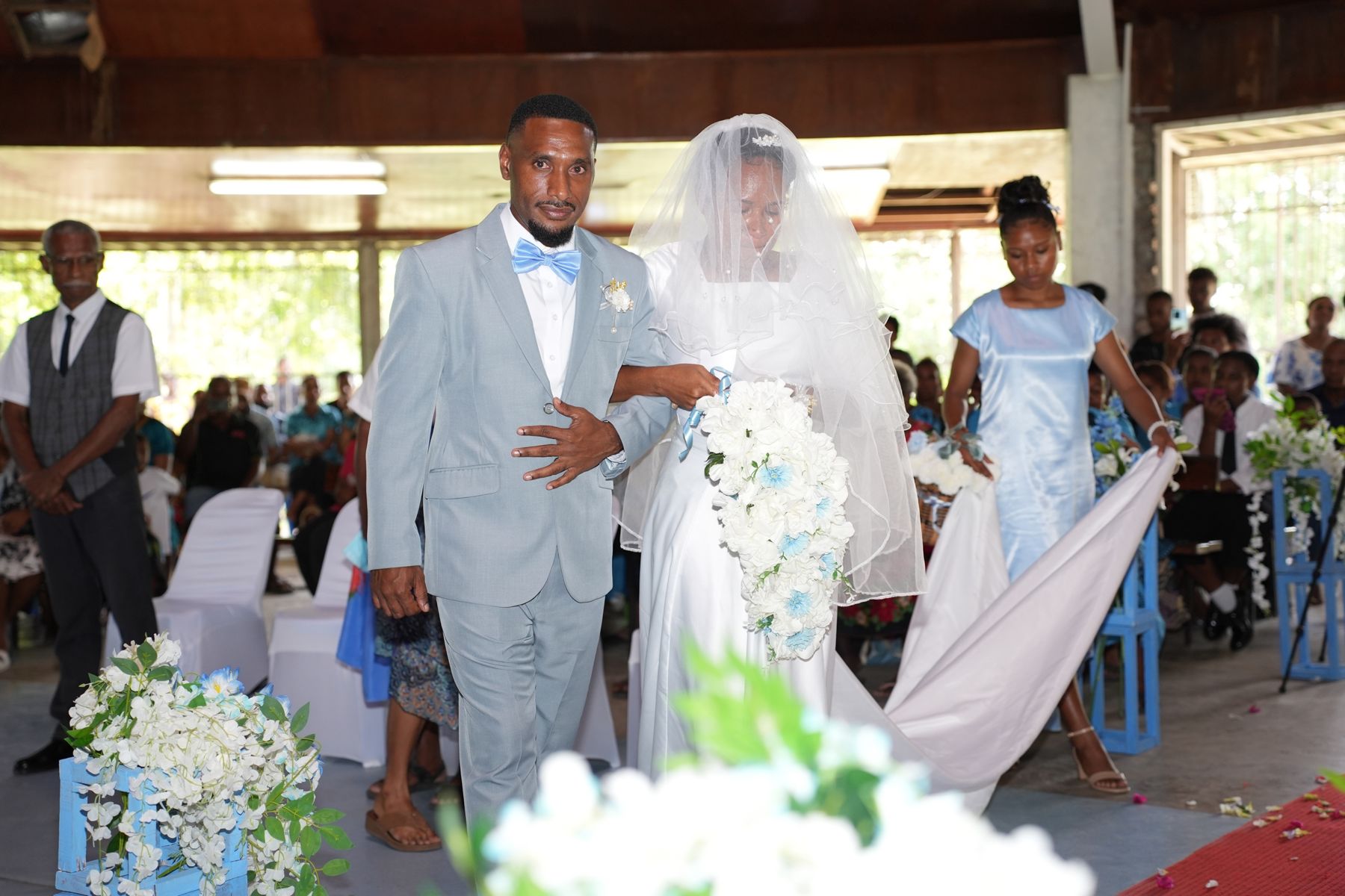 Bride and groom walking down the aisle